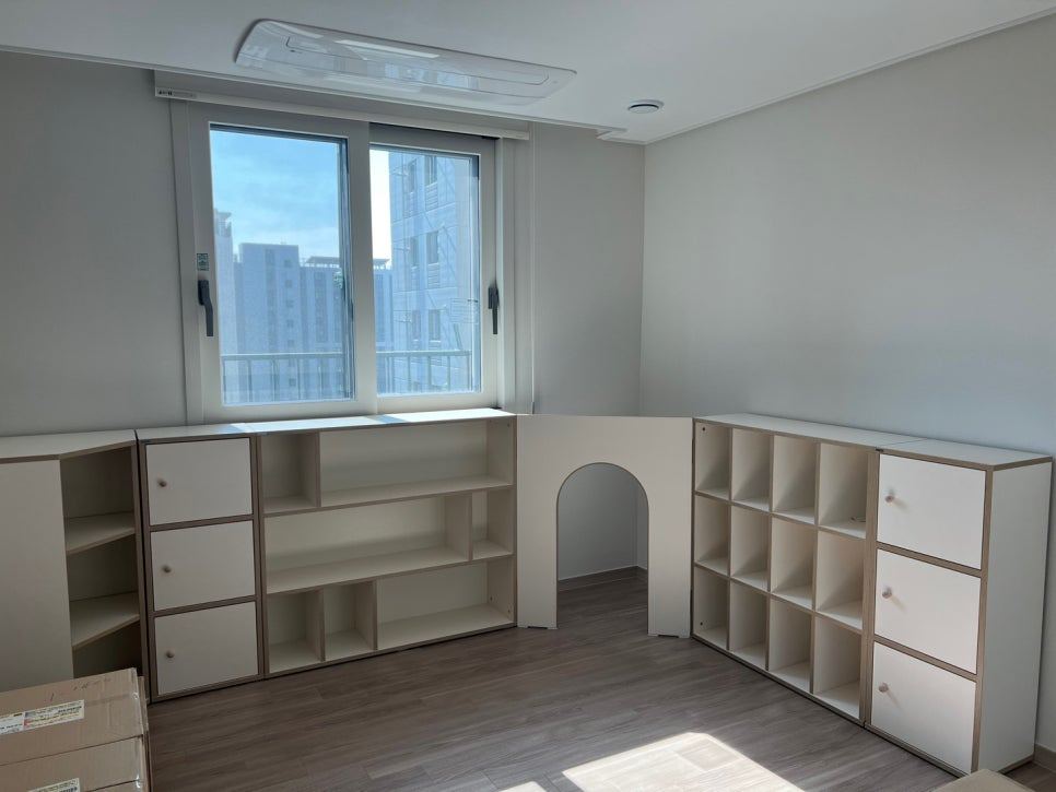 Style reference: a finished minimal bedroom, empty, with a single window