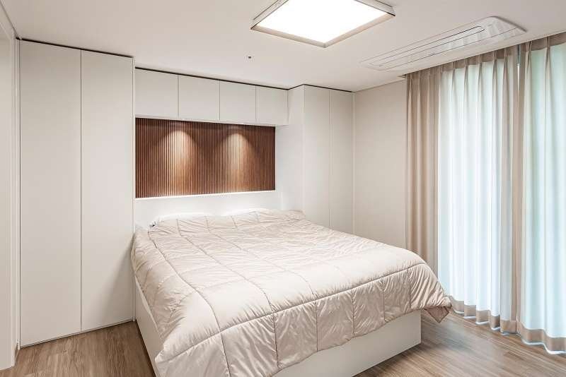 Style reference: bedroom with backlit wood slat headboard wall