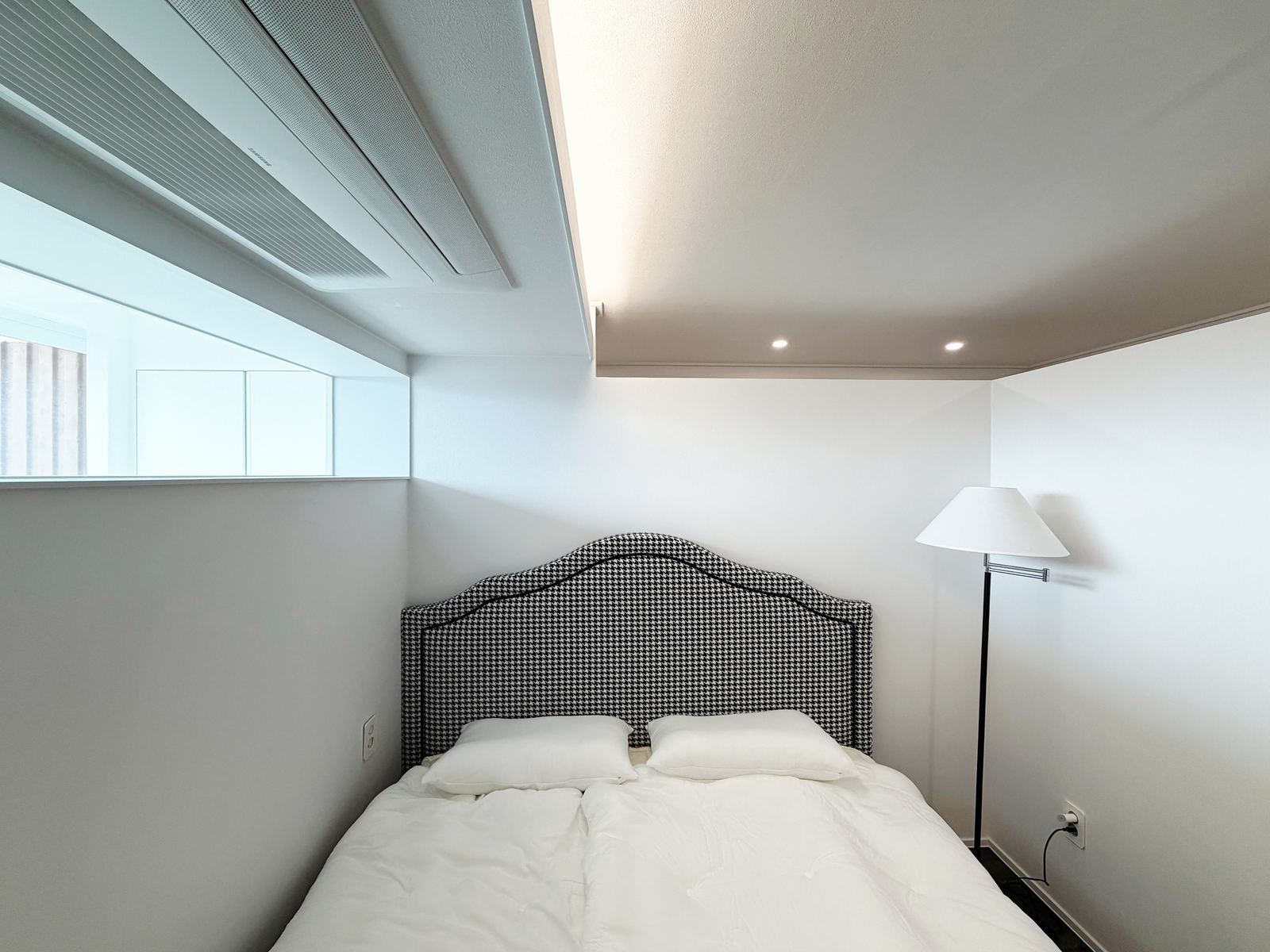 Style reference: a bedroom with an upholstered patterned headboard